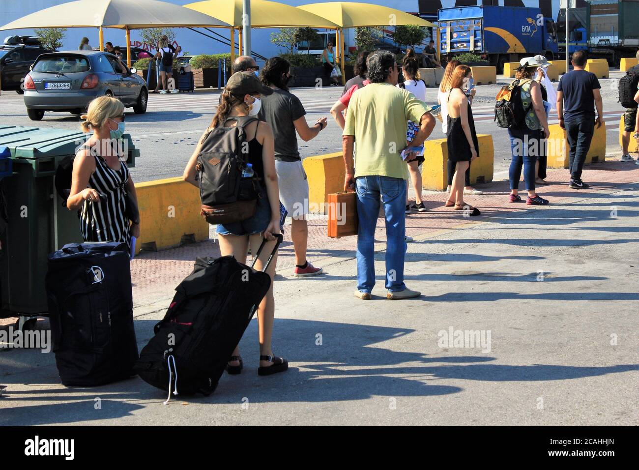 Greece, Piraeus, August 1 2020 - Passengers waiting for buying tickets and embark on a ferry boat with Greek islands as destination. Stock Photo