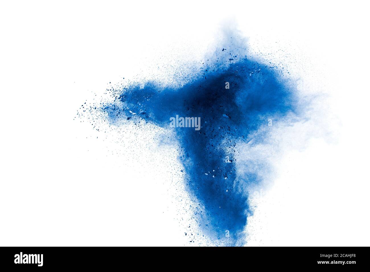 Abstract blue powder explosion on white background. Blue dust particles splash. Stock Photo