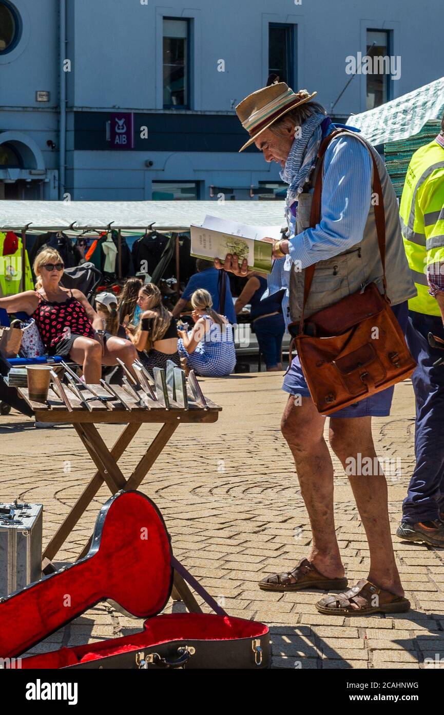 Bantry, West Cork, Ireland. 7th Aug, 2020. The sun shone on Bantry Friday Market today, which brought people out in their droves. It appeared Social Distancing was out of the window as very few people wore masks and Bantry Square was very crowded. The rest of the day will be dry and sunny with highs of 17 to 23 degrees. Ian Bailey was spotted at the market. Credit: AG News/Alamy Live News Stock Photo