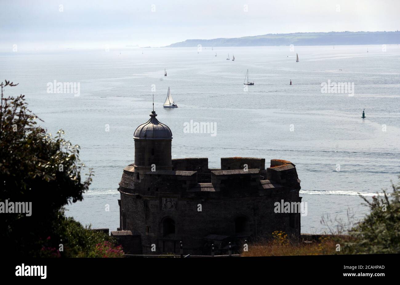 A view from the National Trust's, Trelissick Garden, of small boats on Carrick Roads, the estuary of the River Fal, in Cornwall, as the UK could see record-breaking temperatures with forecasters predicting Friday as the hottest day of the year. Stock Photo