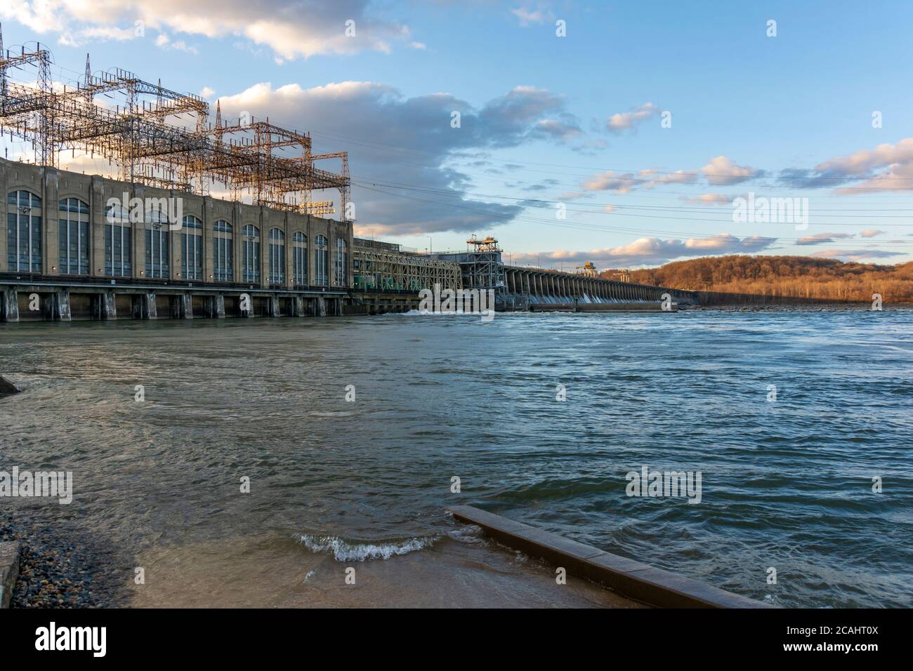 The sun is setting over the Conowingo Dam, which crosses the Susquehanna River in northeastern Maryland, United States. Stock Photo