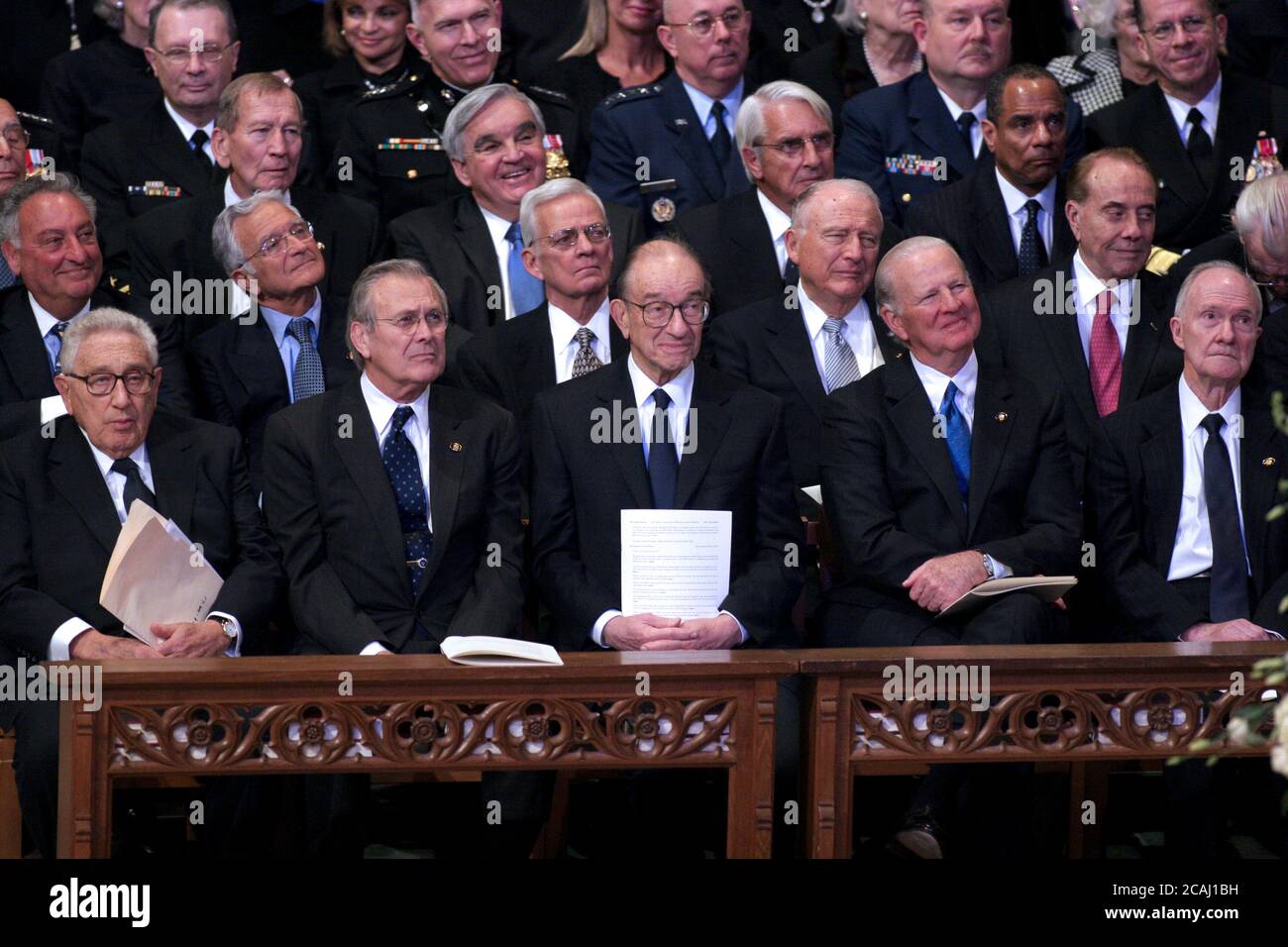 In this file photo, Former Secretary of State Henry Kissinger, former Secretary of Defense Donald Rumsfeld, former Chairman of the Federal Reserve Alan Greenspan, former Secretary of State James A. Baker, III, and former National Security advisor Brent Scowcroft watch the proceedings at the State Funeral for former United States President Gerald R. Ford at the Washington National Cathedral, in Washington, D.C. on Tuesday, January 2, 2007.  Former U.S. Senator Bob Dole (Republican of Kansas) is seated behind Scowcroft..Credit: Ron Sachs / CNP.[NOTE: No New York Metro or other Newspapers within Stock Photo
