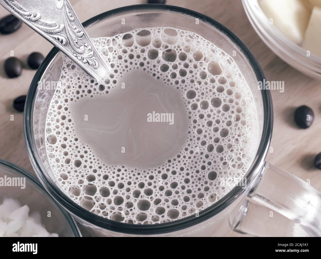 Bulletproof coffee coffee whipped with cream and coconut oil Stock