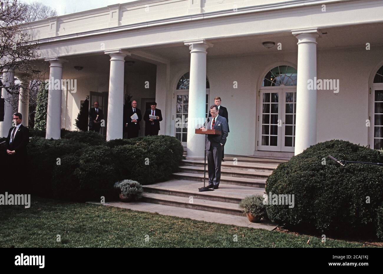 In this file photo, United States President George H.W. Bush reads a statement rejecting the proposed Soviet peace agreement to end the Gulf War with Iraq in the Rose Garden of the White House in Washington, DC on February 22, 1991. Also visible in the photo are White House Press Secretary Marlin Fitzwater, National Security Advisor Brent Scowcroft, White House Chief of Staff John Sununu, and U.S. Vice President Dan Quayle.Credit: Howard L. Sachs/CNP | usage worldwide Stock Photo