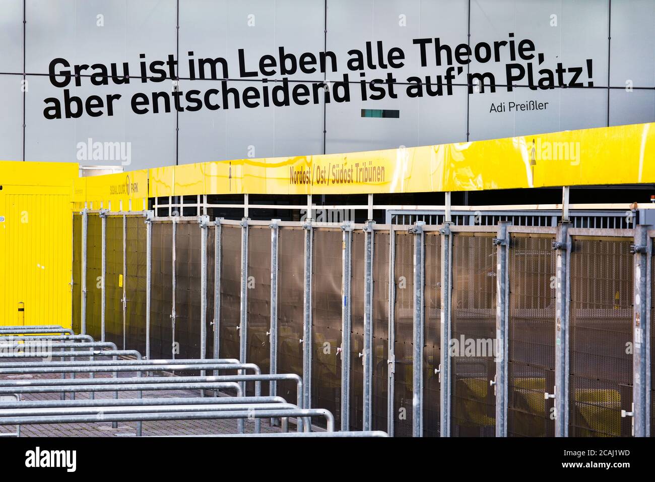 Dortmund, August 7th, 2020: Discussion about the reopening of the football stadiums for fans with a limited number of spectators due to the Corona crisis in the new 2020/21 football season. Photo: Closed entrance gates to the Signal Iduna Park (Westfalenstadion) of the BvB Dortmund Bundesliga soccer club with the quote 'Gray is all theory in life, but what matters is in the square', by Adi Preißler, former BvB player. Stock Photo