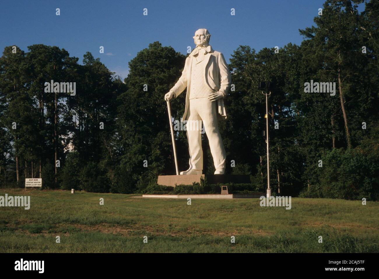 67 foot tall statue of Sam Houston by sculptor David Adickes standing with cane on a green lawn