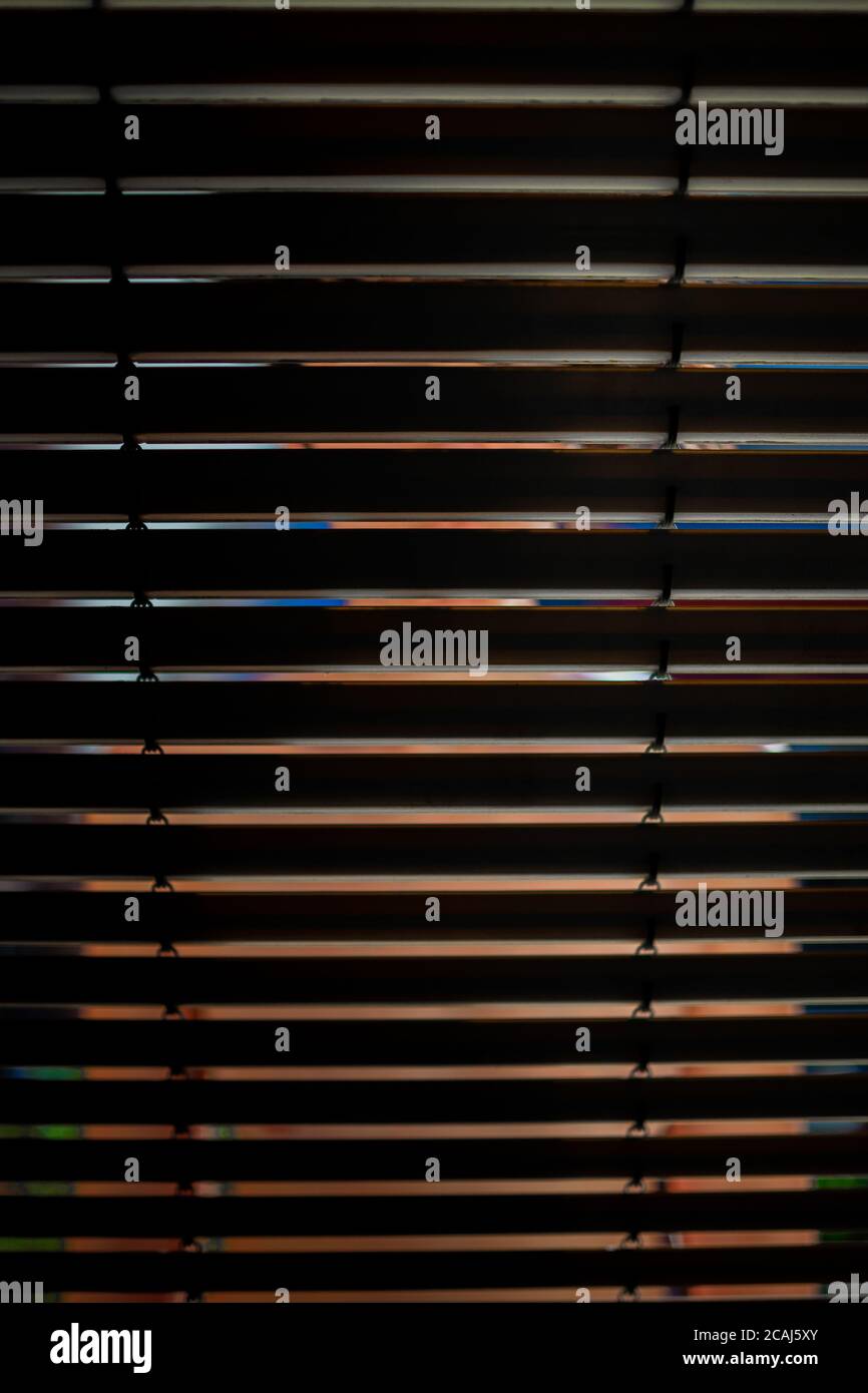 Window Partially Shut Vertical shot of partially closed window blinds with a profile of a ...