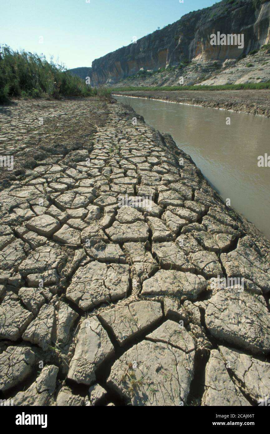 The banks of the Pecos River below the U.S. Highway 90 bridge in Val Verde County at low water level, showing signs of a severe drought in 2004.  ©Bob Daemmrich Stock Photo