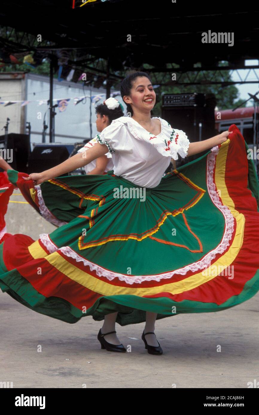 Hispanic female dancing in traditional dress at Cinco de Mayo celebration in Austin, Texas. ©Bob Daemmrich Stock Photo