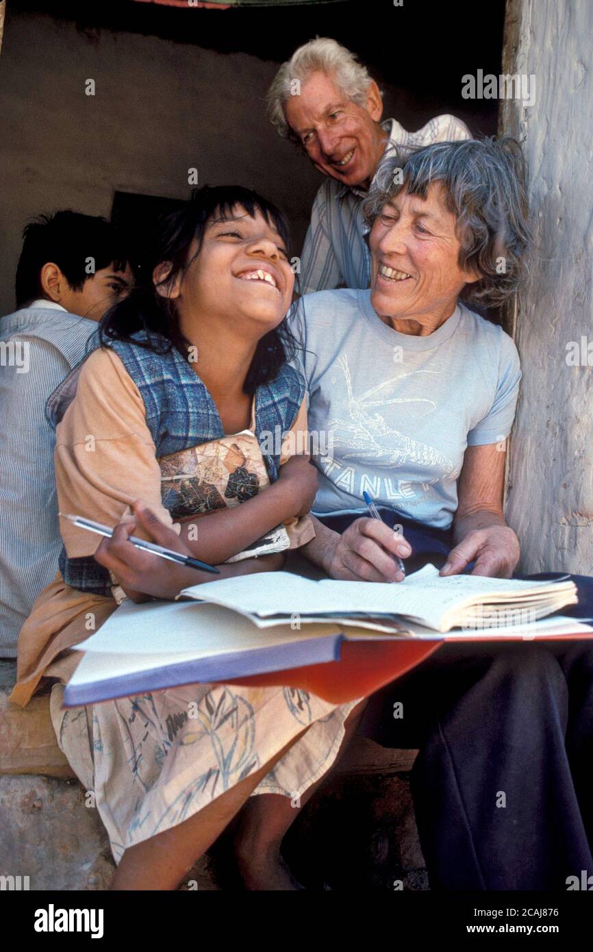 Female American retiree teaching English to Honduran child in the state of Choluteca during a volunteer mission trip. ©Bob Daemmrich Stock Photo