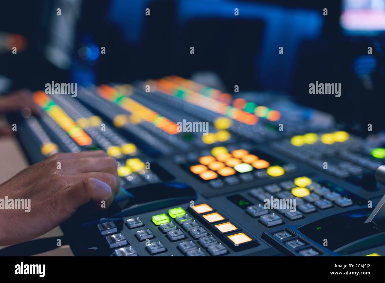 Controlled in a broadcast studio. Video mixer use Stock Photo