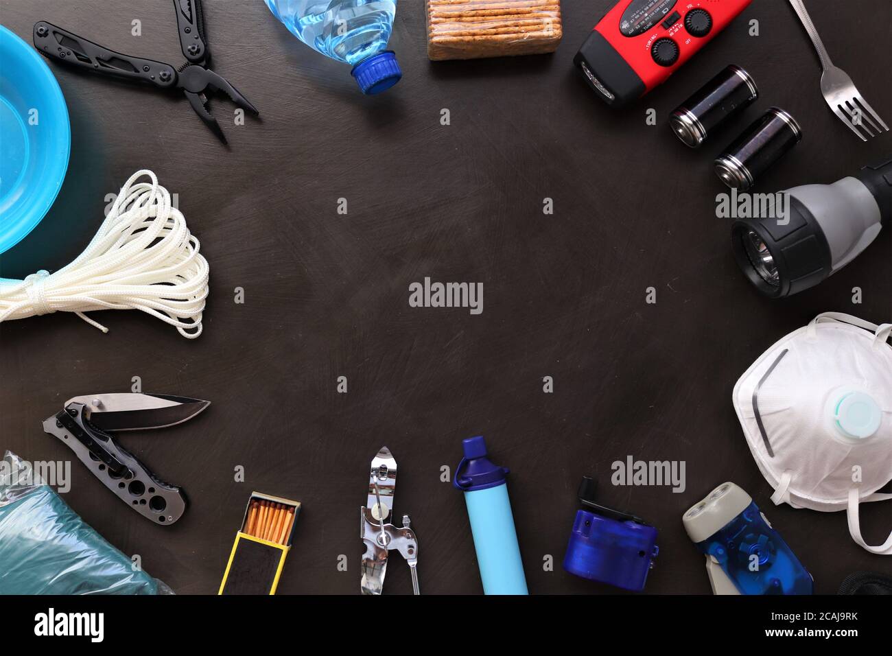 Flat lay view of essential disaster preparedness items arranged neatly ...