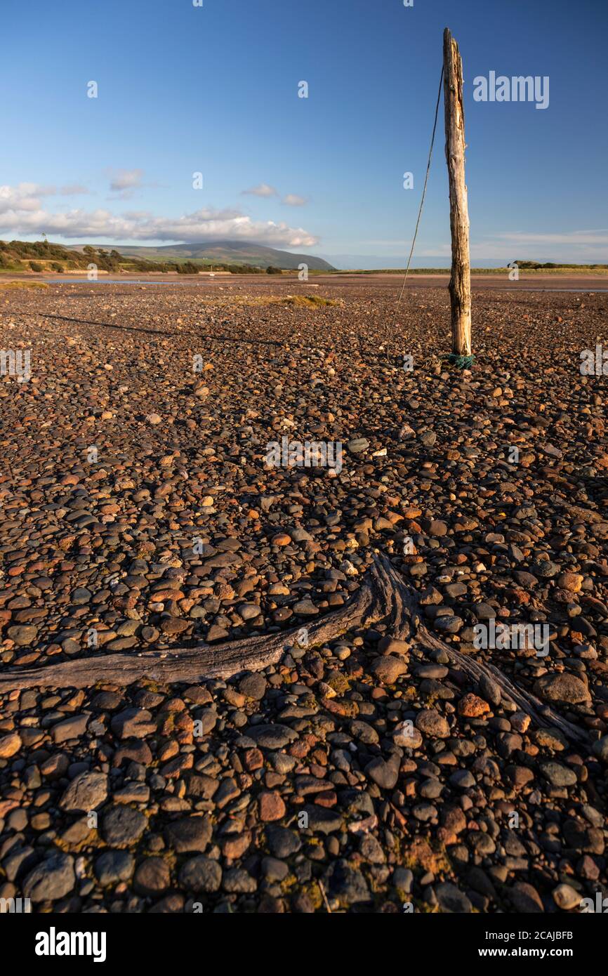 Old mooring post on the beach at Ravenglass, Lake District, England Stock Photo