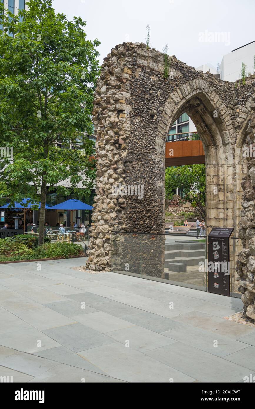 Alongside the ruin of the Tower of St. Elsyng Spital,people dine al fresco at the Barbie GREEN Aussie cafe/restaurant, London Wall, Barbican, London Stock Photo