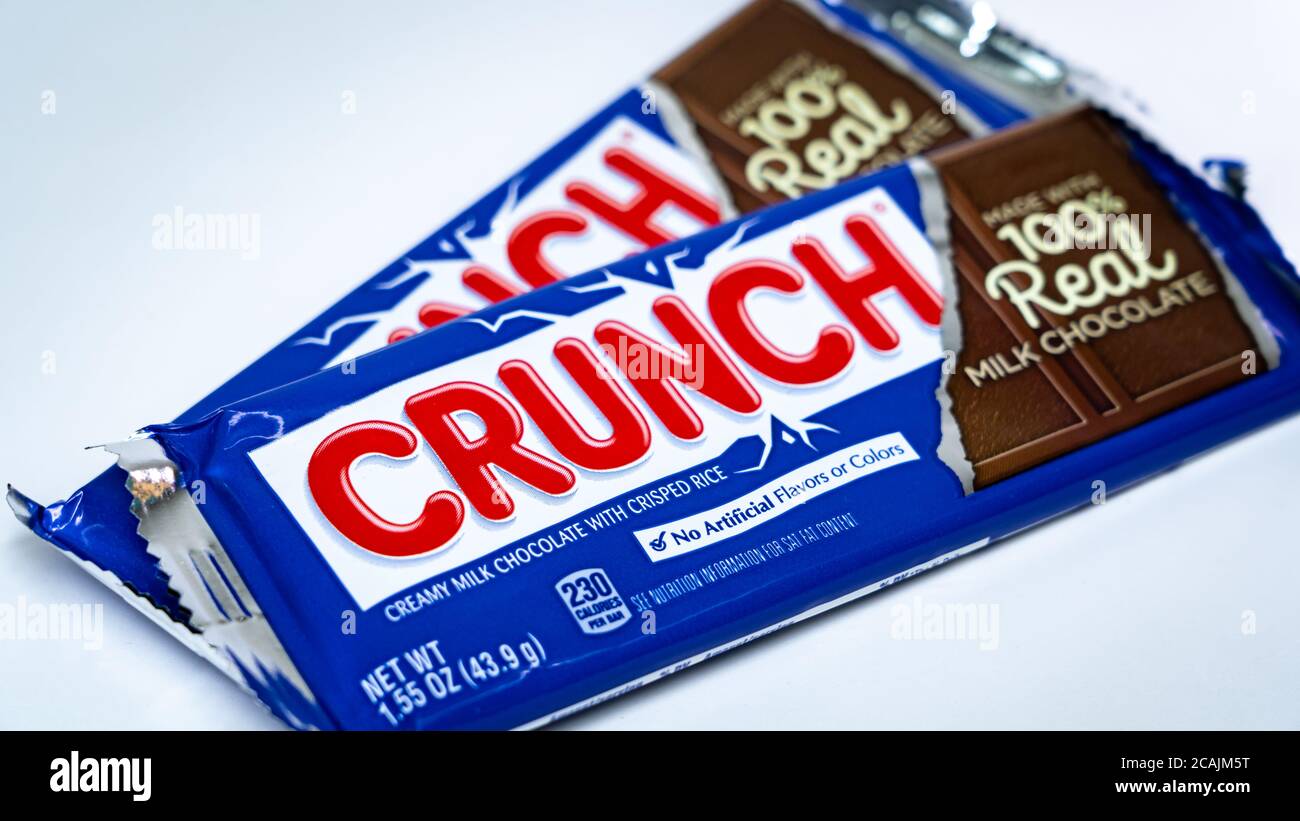 Two bars of Nestle Crunch chocolate bar on a white background Stock Photo
