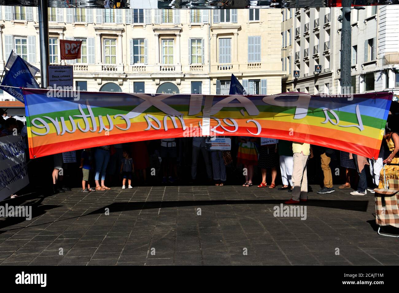 A peace banner during the demonstration.People gathered at the Old Port of Marseille to pay homage to the victims of the bombings on Hiroshima and Nagasaki, as well as to denounce the dangers of this nuclear weaponry. Stock Photo