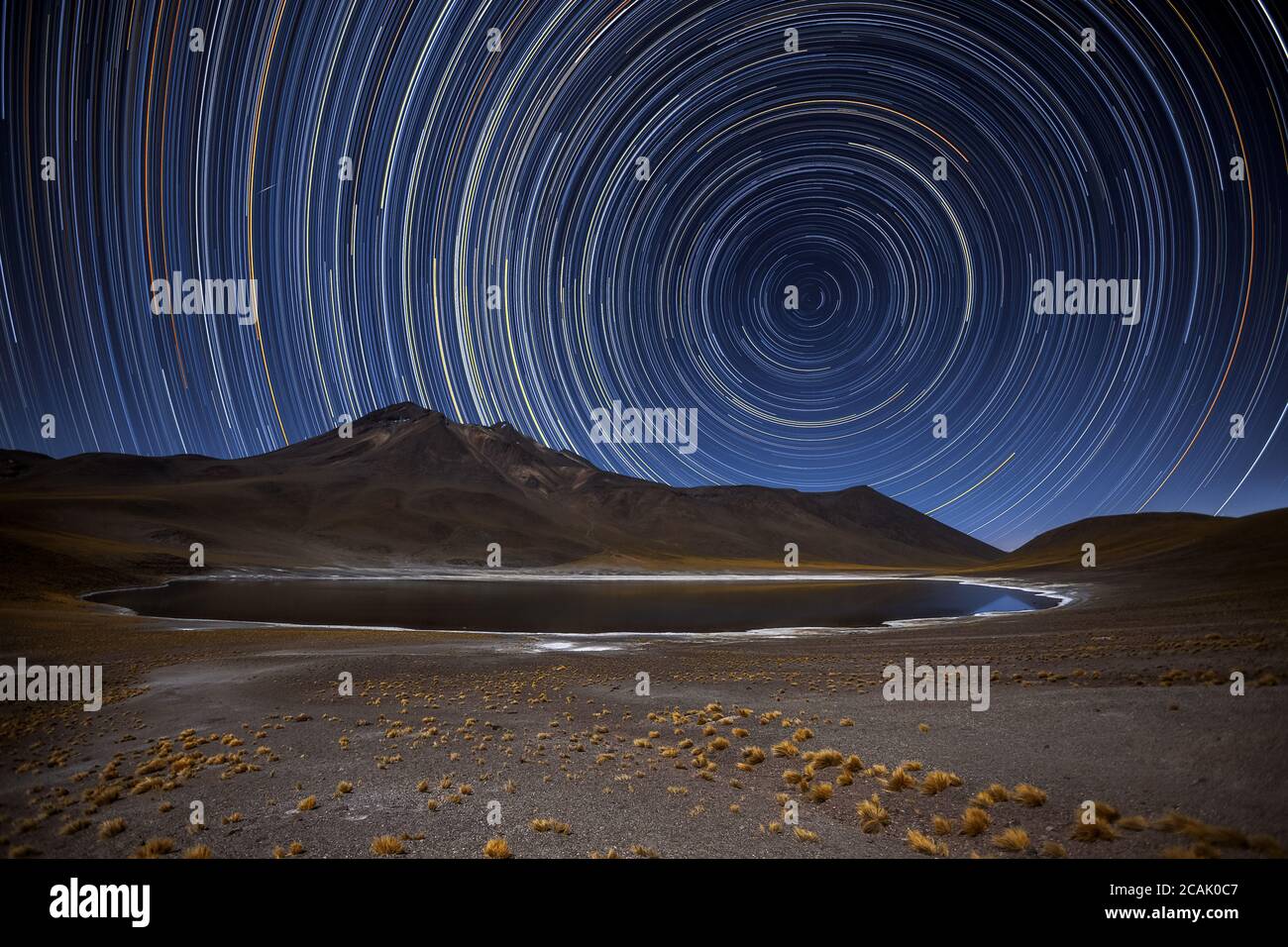 Science and art unite in this beautiful photograph, taken in Chile’s Atacama Desert by ESO Photo Ambassador Adhemar M. Duro Jr. To create this visual masterpiece Adhemar pointed his camera at the sky’s south pole, the point at the centre of all the bright arcs and circles. All the stars in the night sky revolve around this point. Over a period of several hours, this motion creates star trails, with each individual star tracing out a circle on the sky. These trails display the various brightnesses and colours of each star, creating a captivating scene! Towards the top left of the image, you can Stock Photo
