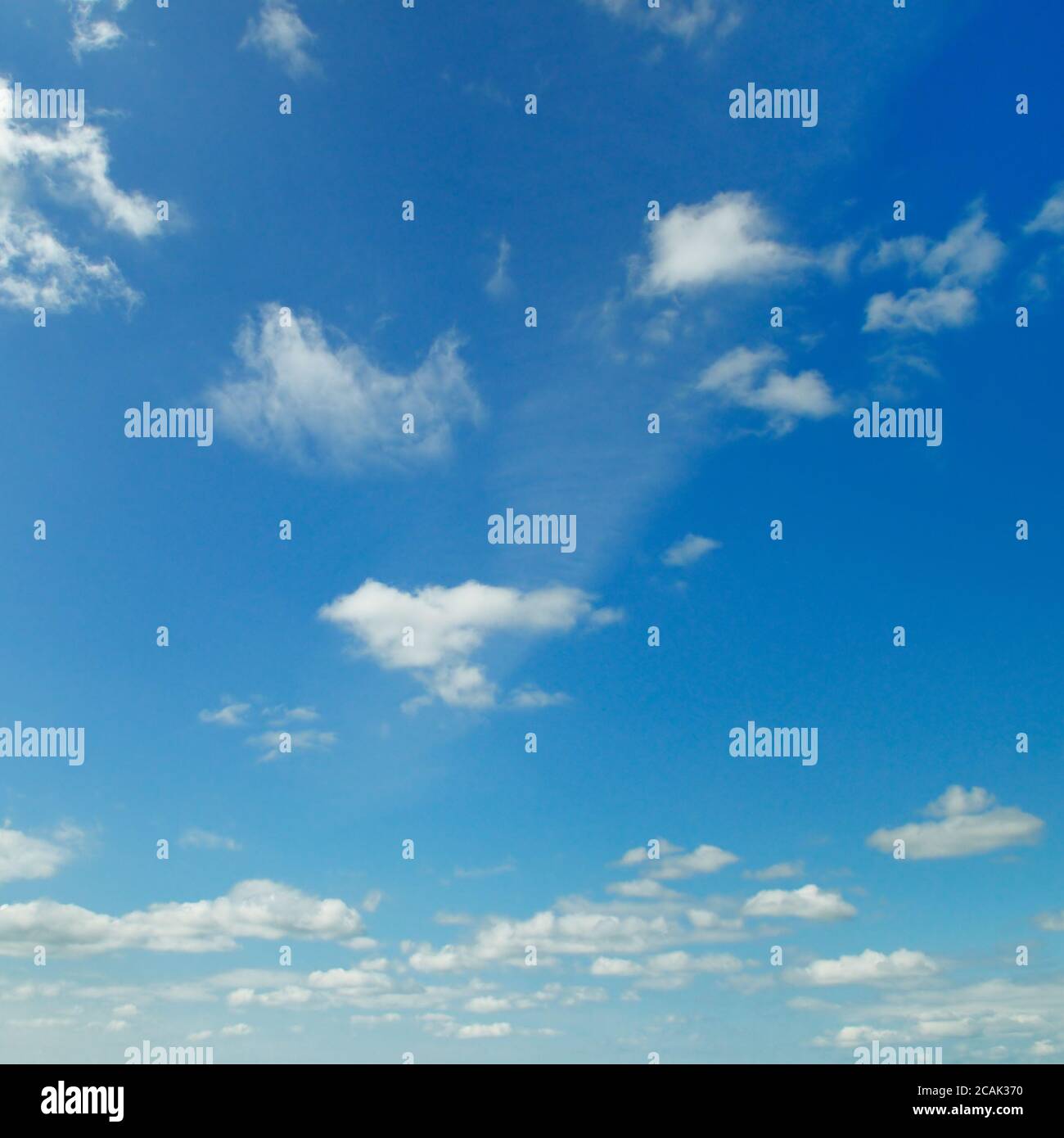 light cumulus clouds in the blue sky Stock Photo - Alamy