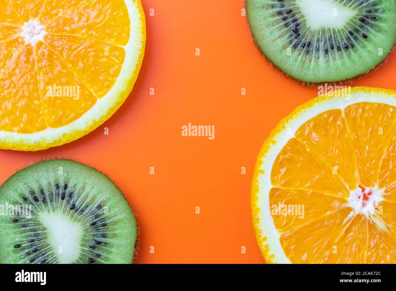 Citrus background, sliced orange and kiwi. Tropical abstract