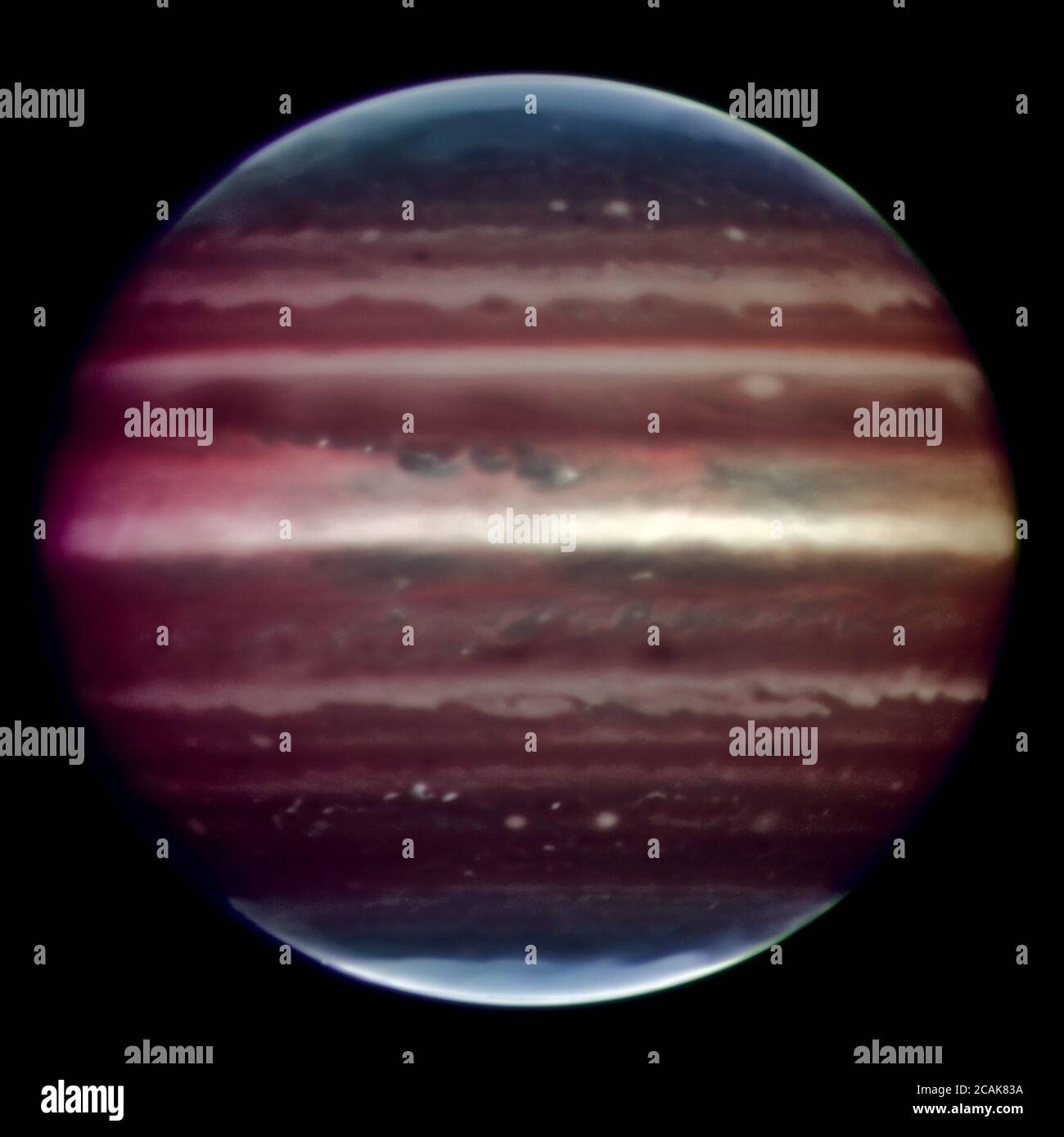 Amazing image of Jupiter taken in infrared light on the night of 17 August 2008 with the Multi-Conjugate Adaptive Optics Demonstrator (MAD) prototype instrument mounted on ESO's Very Large Telescope. This false colour photo is the combination of a series of images taken over a time span of about 20 minutes, through three different filters (2, 2.14, and 2.16 microns). The image sharpening obtained is about 90 milli-arcseconds across the whole planetary disc, a real record on similar images taken from the ground. This corresponds to seeing details about 300 km wide on the surface of the giant pl Stock Photo