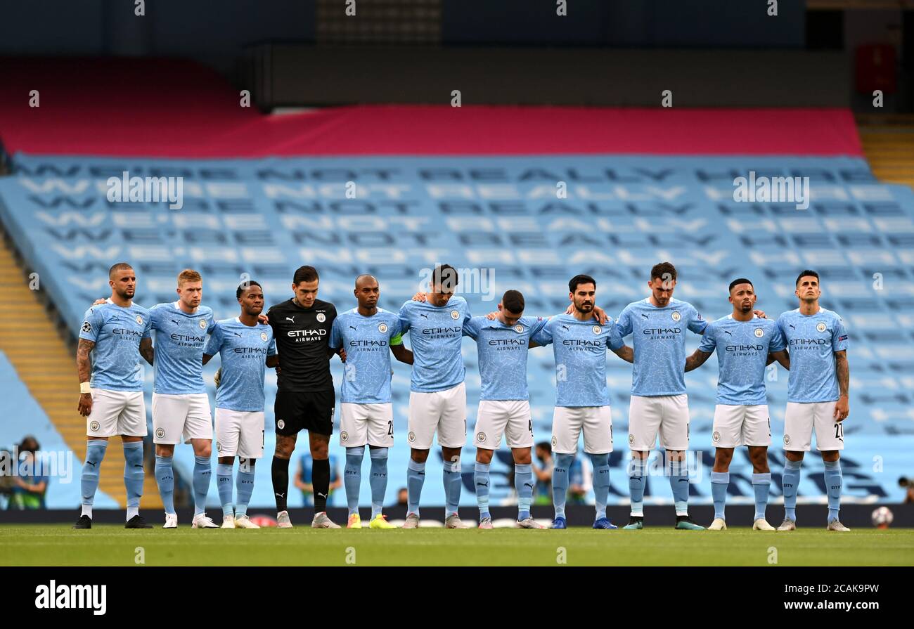 Manchester City take part in minutes silence for victims of COVID-19 during the UEFA Champions League, round of 16, second leg match at the Etihad Stadium, Manchester. Friday August 7, 2020. See PA story SOCCER Man City. Photo credit should read: Shaun Botterill/NMC Pool/PA Wire. Stock Photo