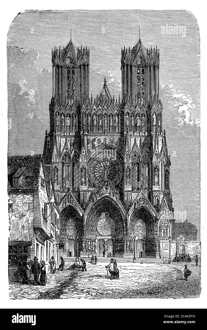 Notre-Dame cathedral in Reims,France where the kings of France were crowned; built in Carolingian times and completed in XII century in French Gothic style with two high towers, statues and  a rose window Stock Photo
