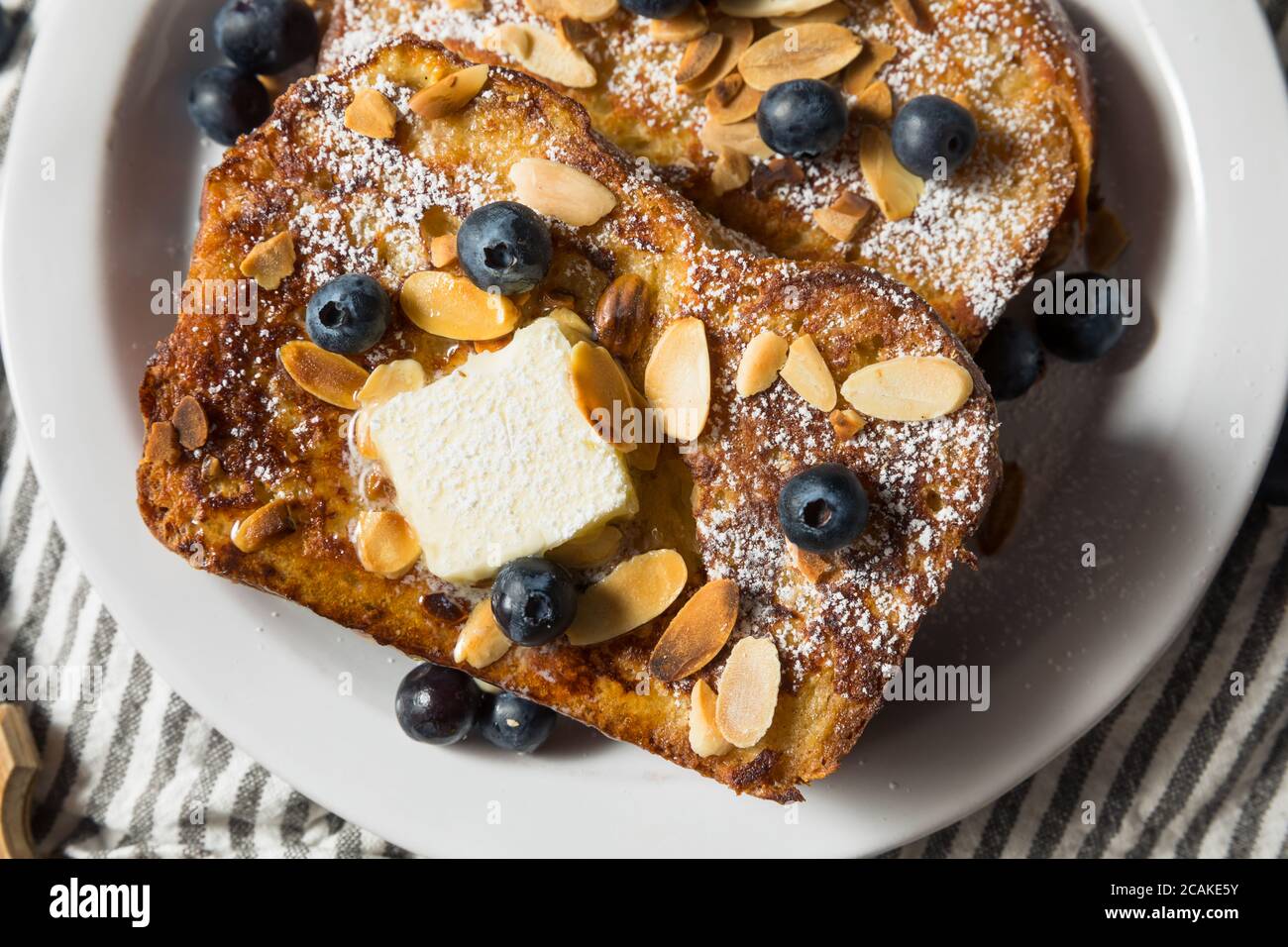 Homemade Brioche French Toast with Blueberries and Almonds Stock Photo