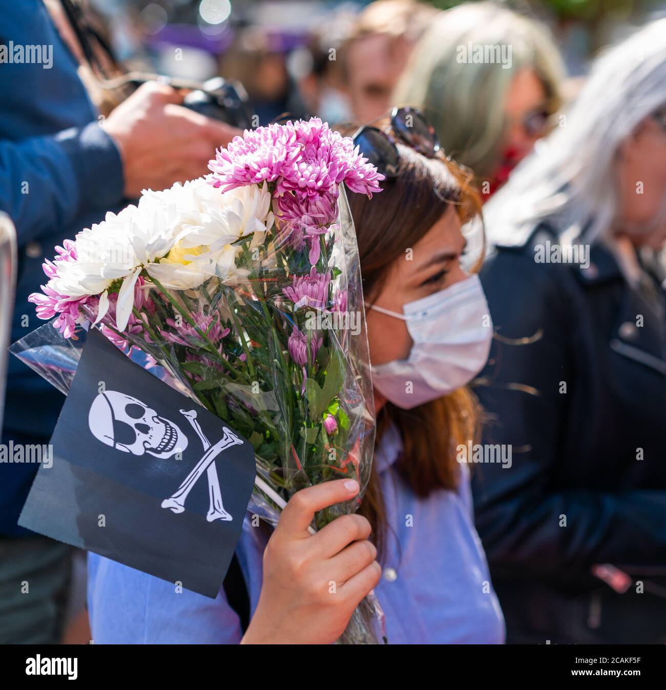 LONDON, ENGLAND - JULY 28, 2020: Beautiful female Johnny Depp fan outside the High Court  wearing a face mask during the Court case against The Sun Ne Stock Photo