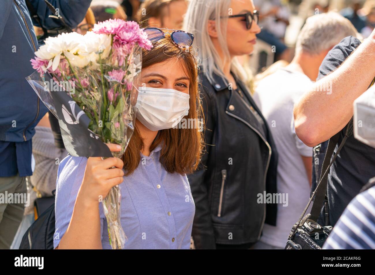 LONDON, ENGLAND - JULY 28, 2020: Beautiful female Johnny Depp fan outside the High Court  wearing a face mask during the Court case against The Sun Ne Stock Photo
