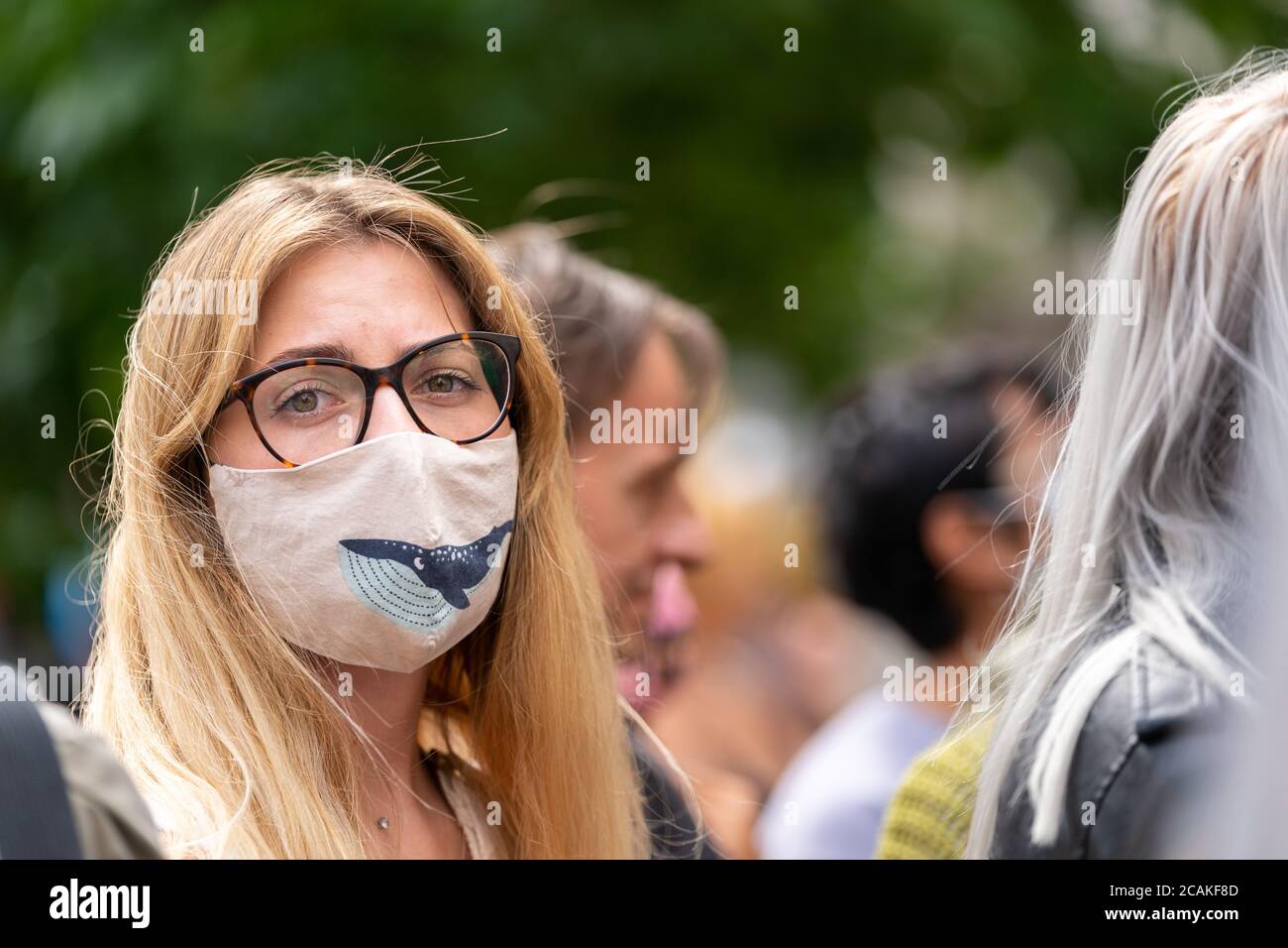 LONDON, ENGLAND - JULY 28, 2020: Beautiful female Johnny Depp fan outside the High Court in London wearing a face mask  during the Court case against Stock Photo