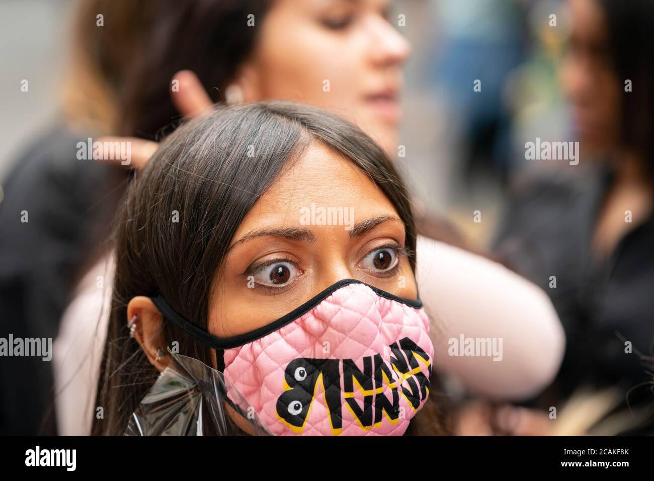 LONDON, ENGLAND - JULY 28, 2020: Beautiful female Johnny Depp fan outside the High Court wearing a face mask during his Court case struck with surpris Stock Photo