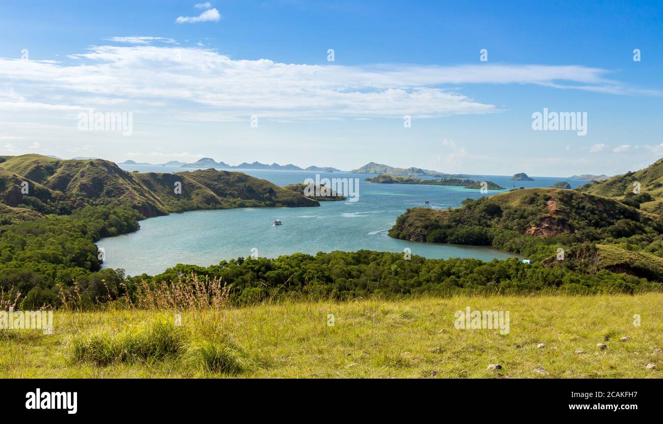 A landscape view over Komodo National Park from Rinca Island, Flores, Indonesia, on a sunny afternoon Stock Photo