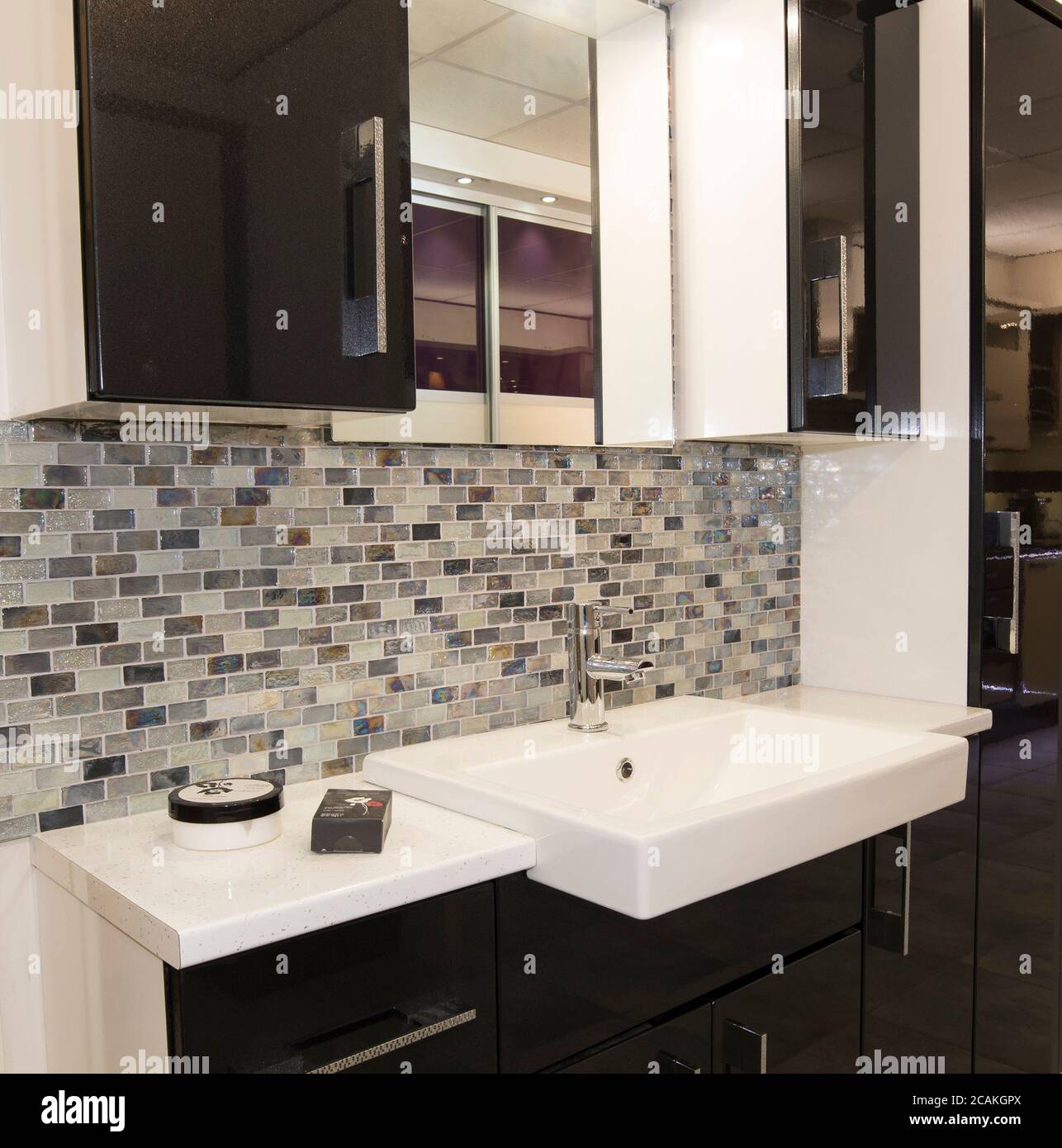Modern bathroom basin and splash back tiledwall Stock Photo