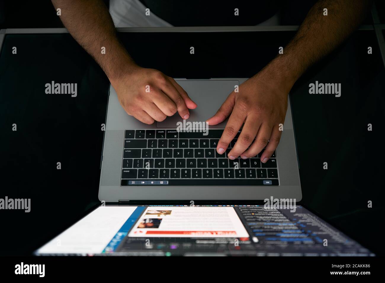 typing on laptop keyboard Stock Photo