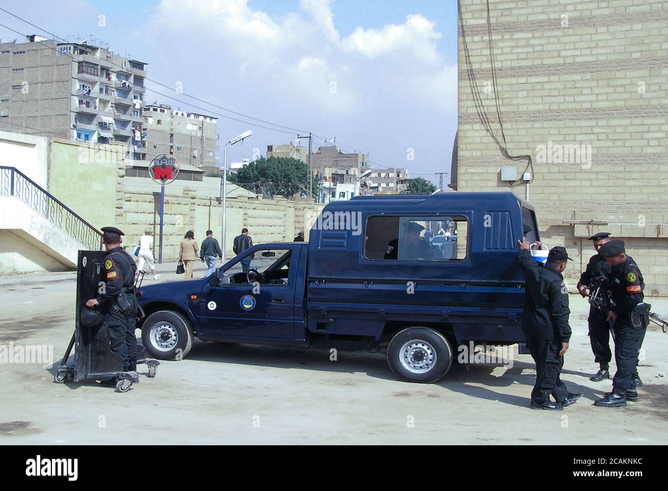 Egyptian policemen cheking their guns in a high security area of Cairo