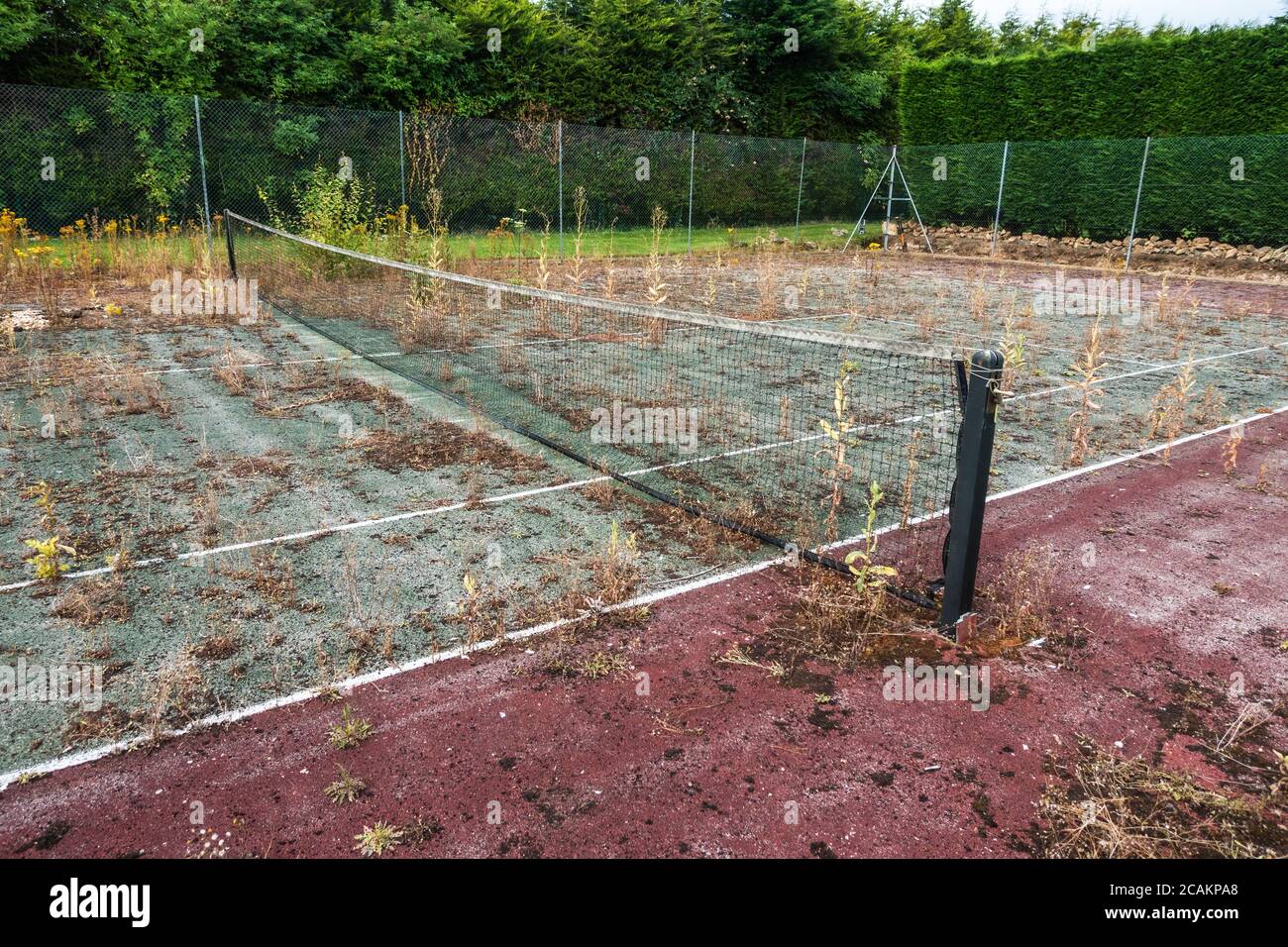 Disused tennis court in bad repair Stock Photo Alamy