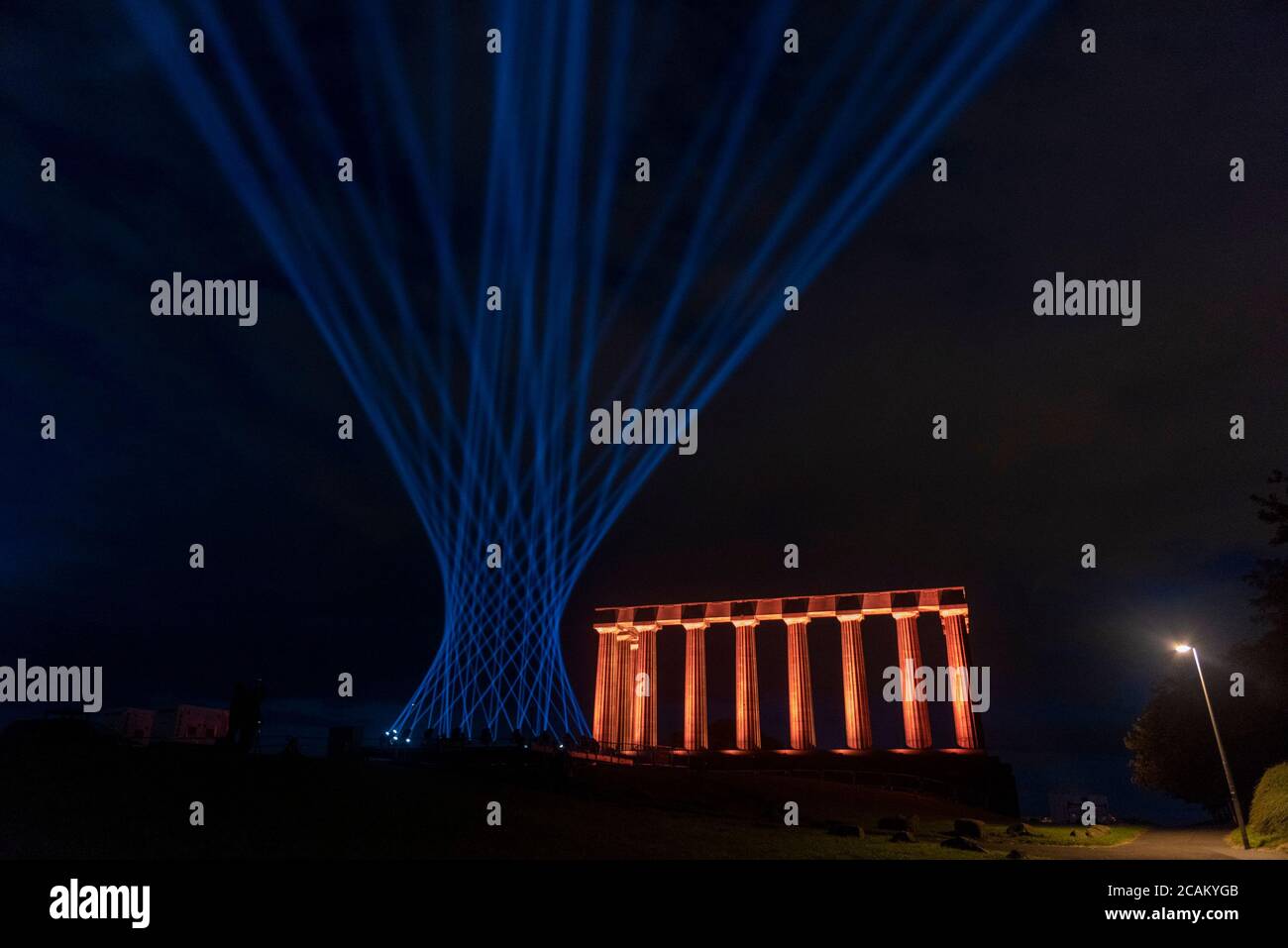 Edinburgh, Scotland, UK. Friday 7th of August 2020: Edinburgh international Festival. The view from Calton Hill as the city skyline is illuminated by over 260 beams of light marking what would have been the opening weekend of the 2020 Edinburgh International Festival.   Calton Hill is one of 13 landmarks across the city to be illuminated as part of an outdoor light installation created by Edinburgh International Festival Stock Photo