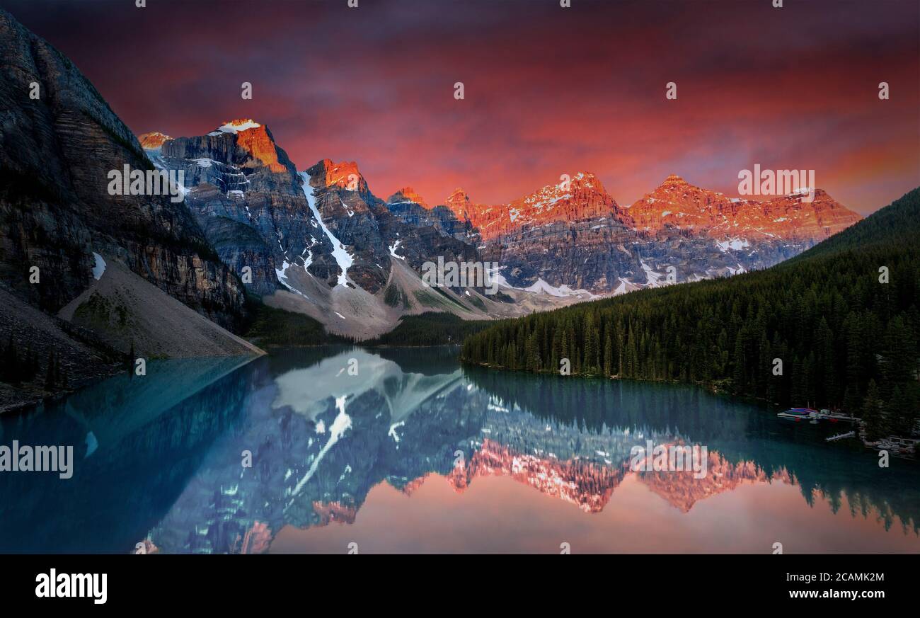 First light of dawn at Moraine Lake with golden sunrise over the Valley ...