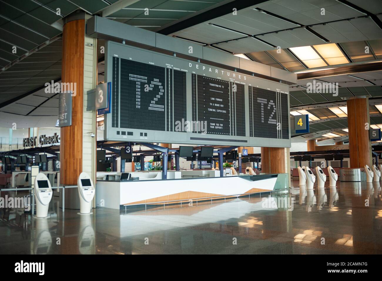 05.08.2020, Singapore, Republic of Singapore, Asia - Flight information display inside the closed and empty departure hall at Changi Airport T2. Stock Photo