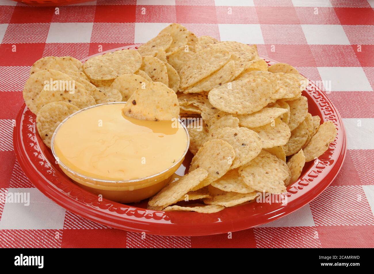 Round tortilla chips with cheddar cheese dip Stock Photo Alamy