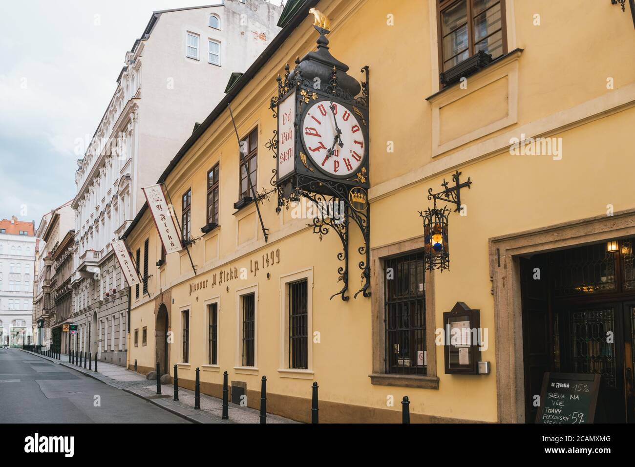 Prague, Czech Republic - July 10 2020: U Fleku Pivovar Restaurant, Beer Hall and Brewery Entrance with Clock. One o the Oldest Pubs in Prague Old Town Stock Photo