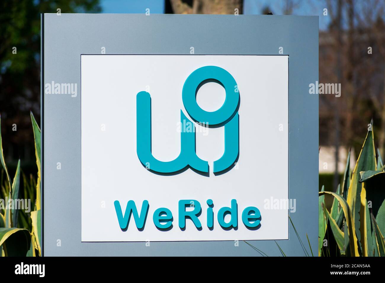 WeRide logo and sign on Silicon Valley office of chinese mobility company. WeRide.ai, formerly Jingchi.ai, works on L4 autonomous driving technologies Stock Photo