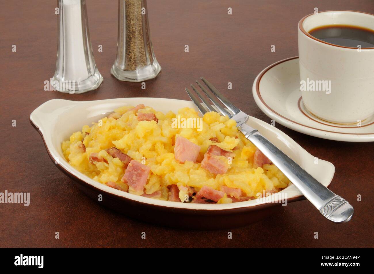 Small casserole dish of diced ham and augratin potatoes Stock Photo Alamy