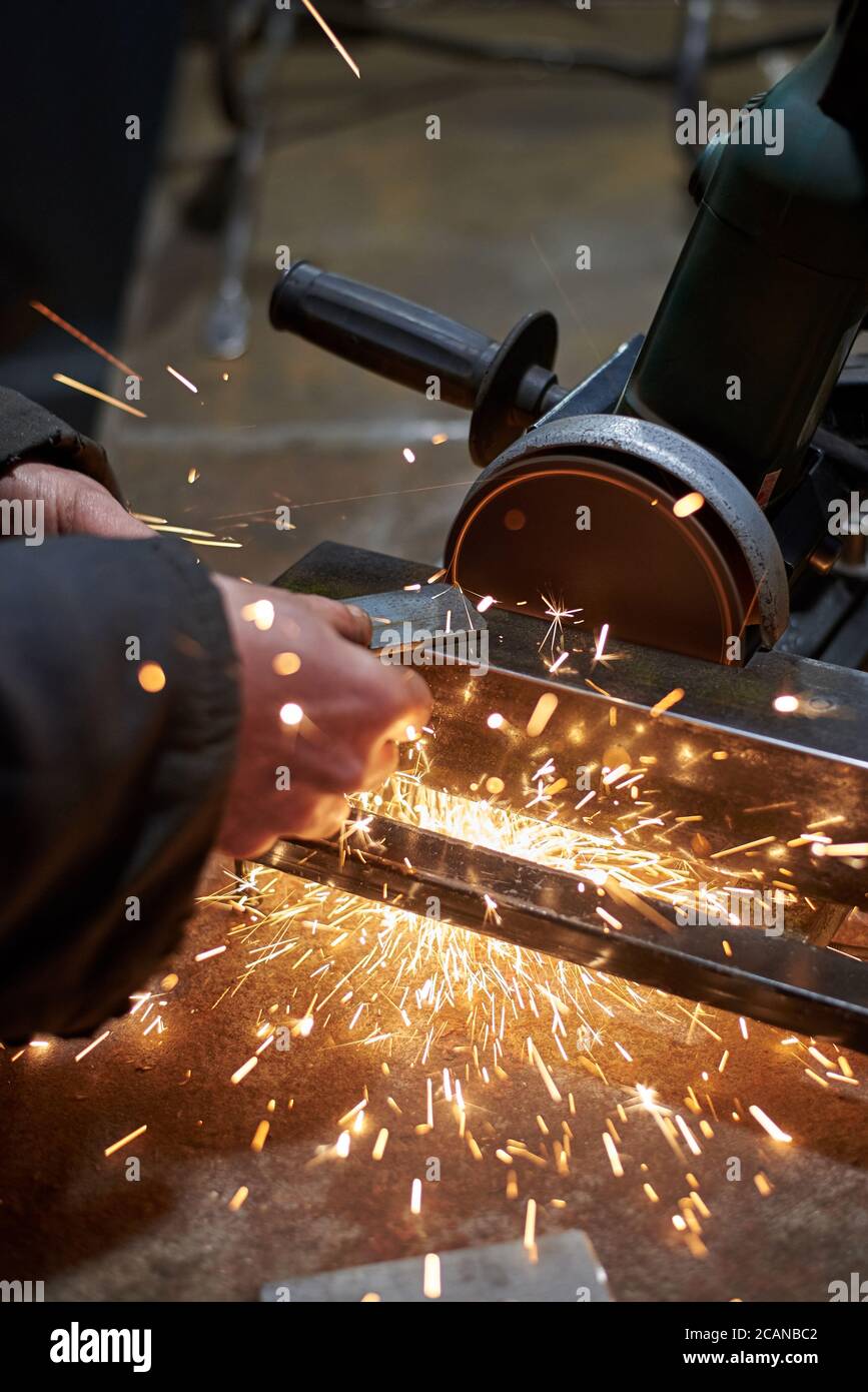 Angle grinder cuts metal bar hi-res stock photography and images - Alamy