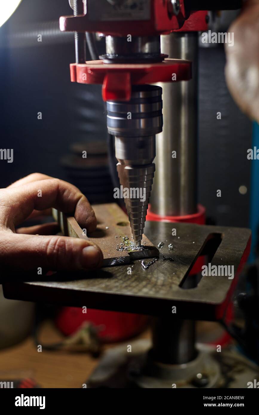 Man worker drills metal electric hi-res stock photography and images ...