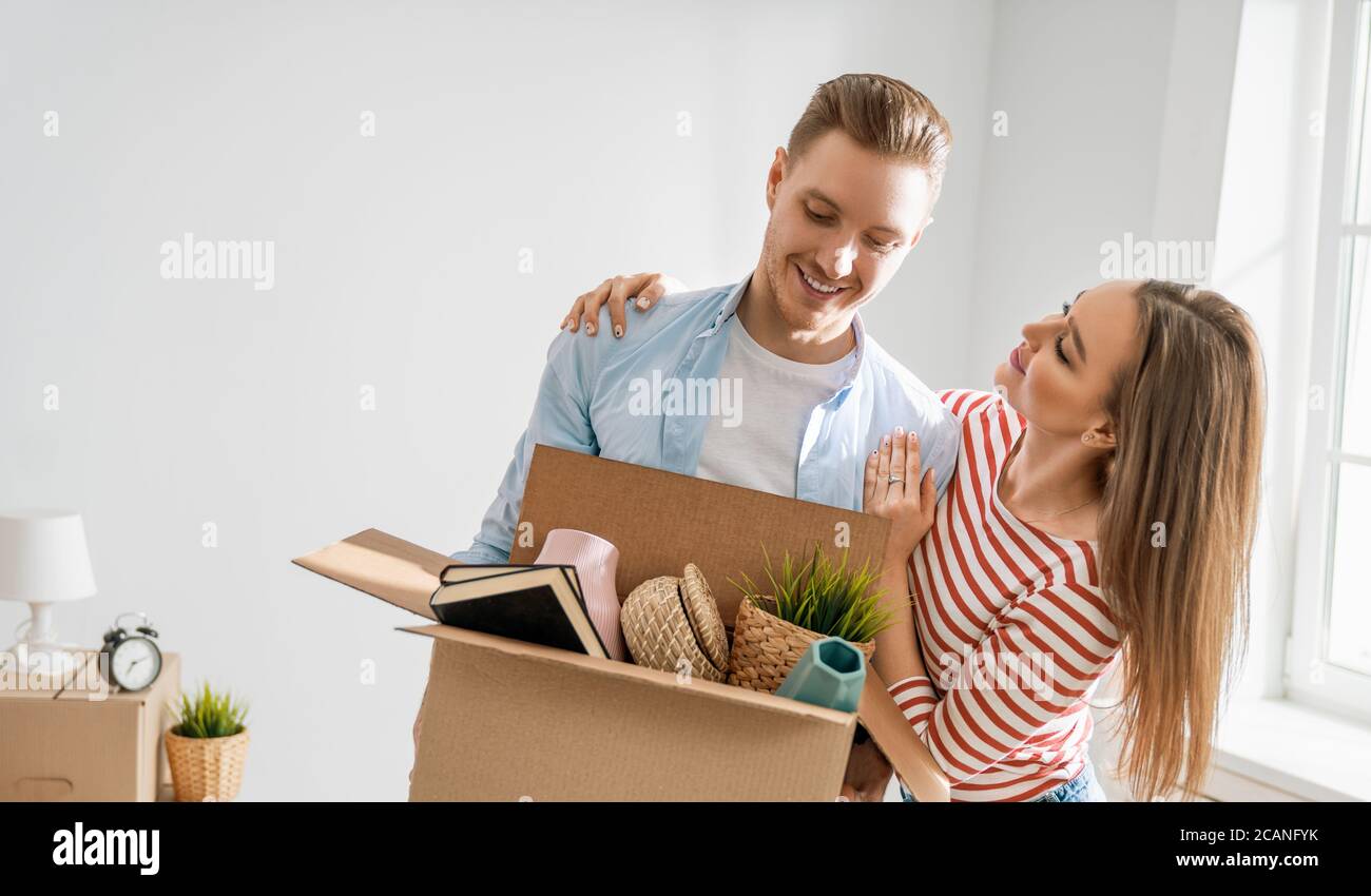 Happy young married couple are moving to new apartment Stock Photo - Alamy