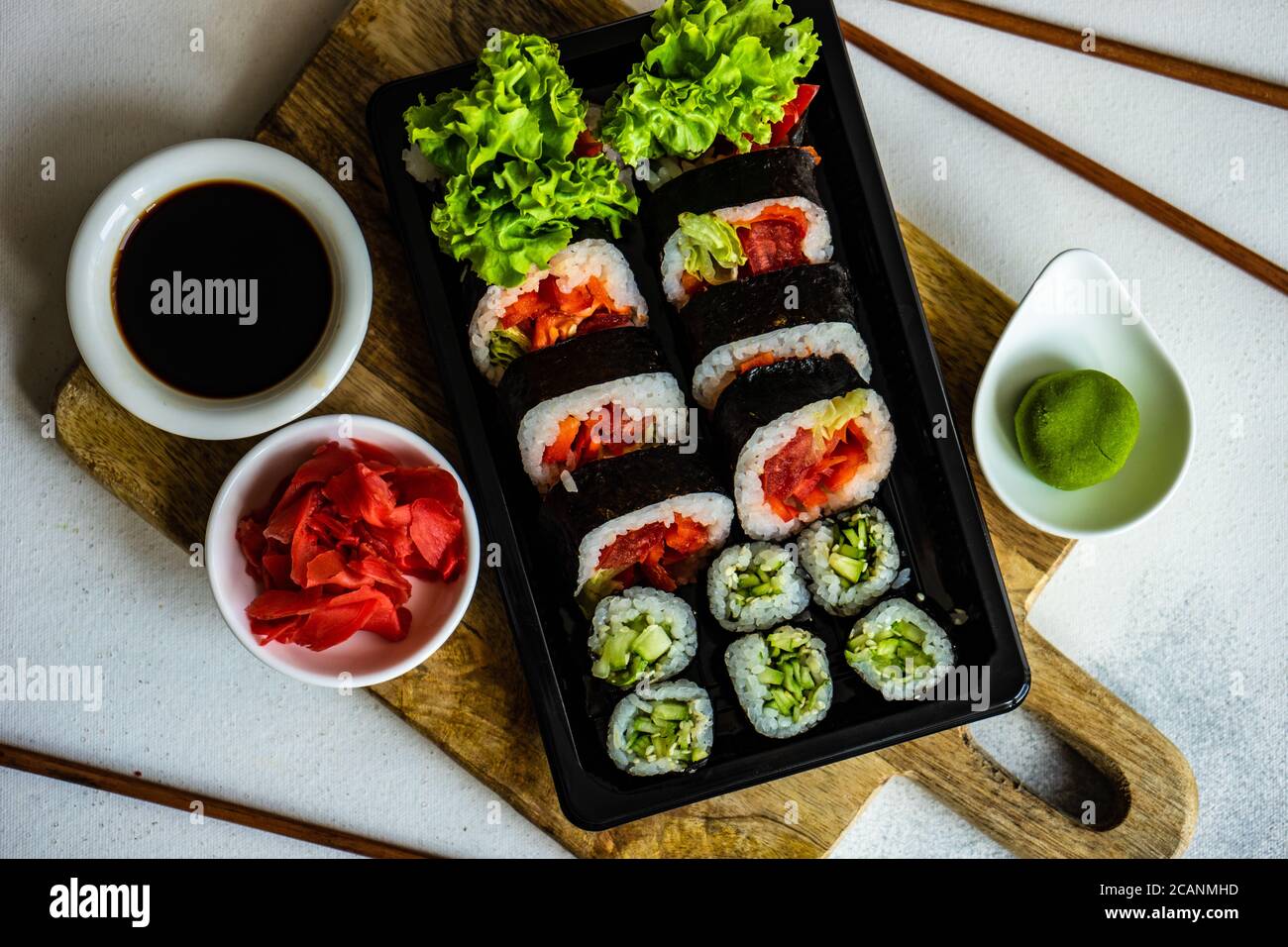 Sushi set with futo maki and kappa maki served on stone table with  chopsticks Stock Photo - Alamy
