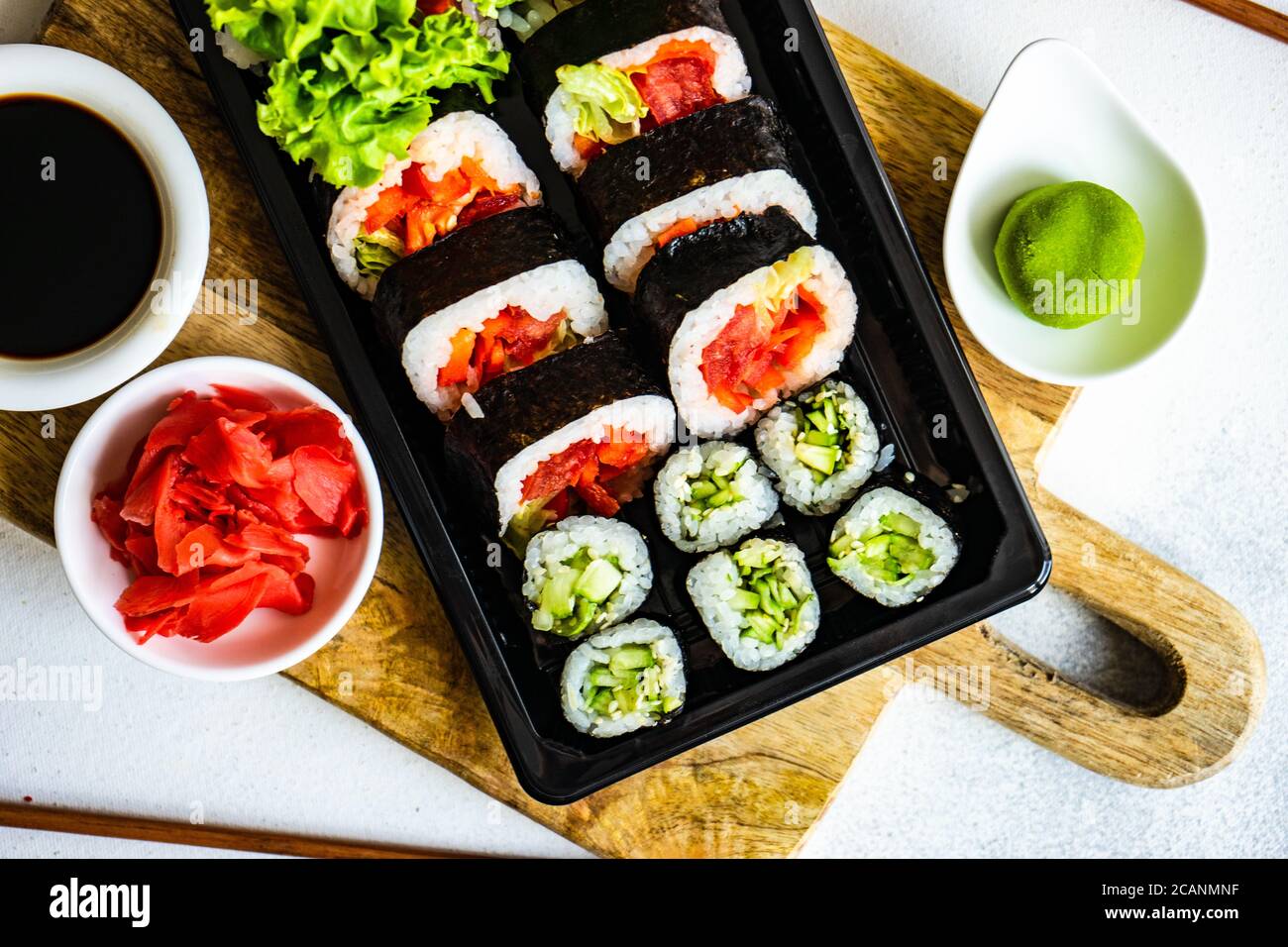 Sushi set with futo maki and kappa maki served on stone table with  chopsticks Stock Photo - Alamy
