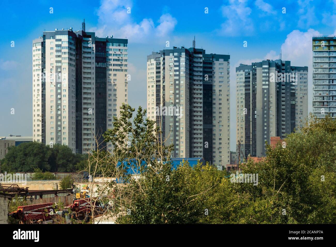 Multi-storey apartment buildings on the banks of rivers. The photo was taken on the banks of the Miass River, Chelyabinsk, Russia. Stock Photo