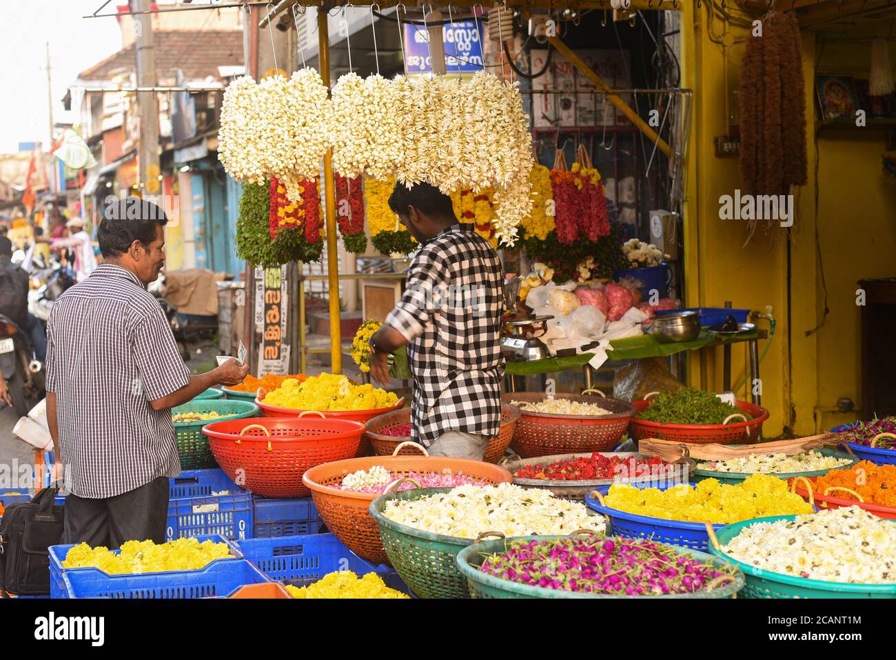 Kerala, India. September 07, 2019. Flower shop on the street at Chalai Bazaar Thiruvananthapuram or Trivandrum. Many garlands hanging in the shop Stock Photo
